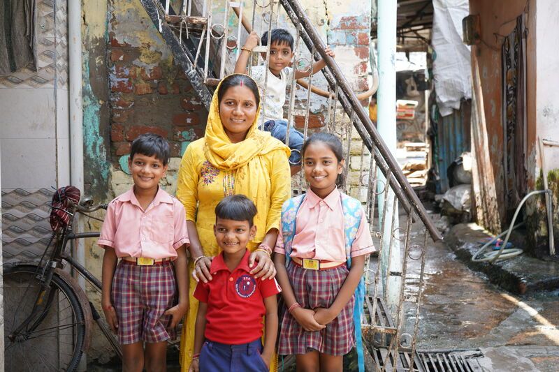 A mother stood with her 4 children.