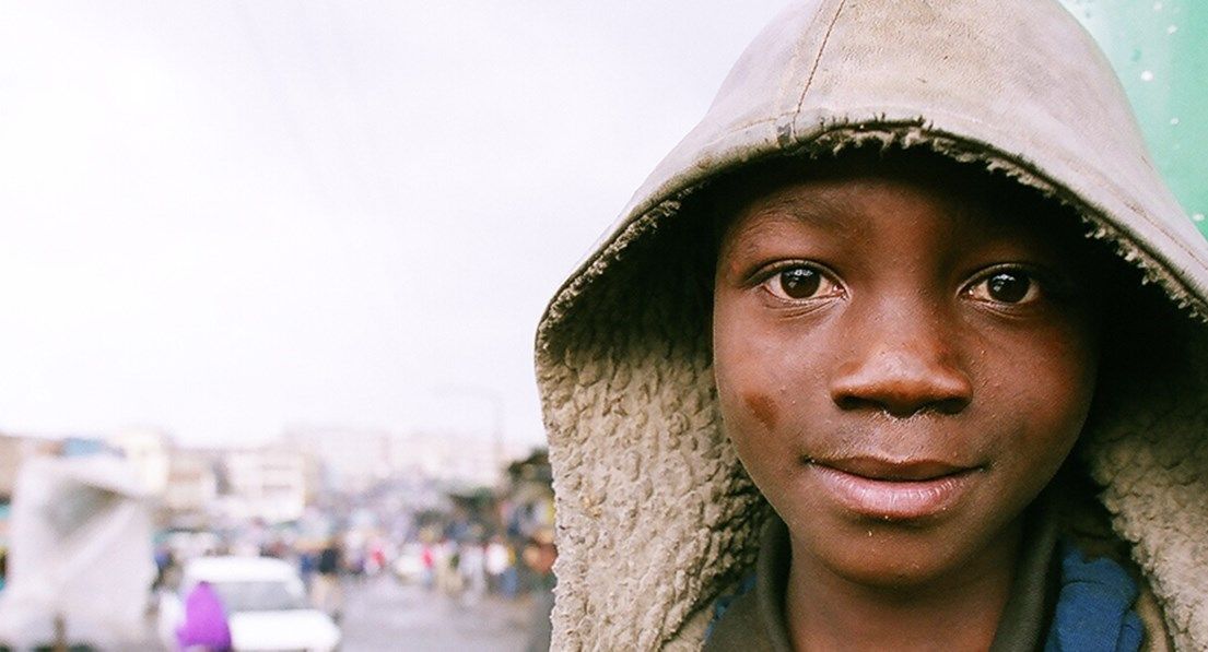 Tanzania boy smiles at camera