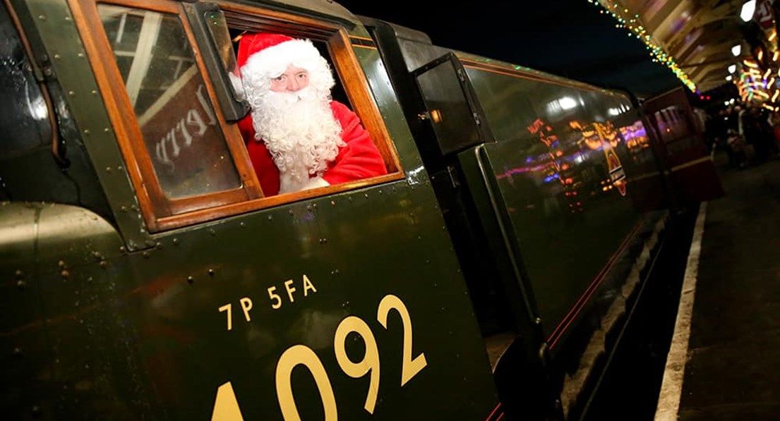 Santa claus looking out of train window