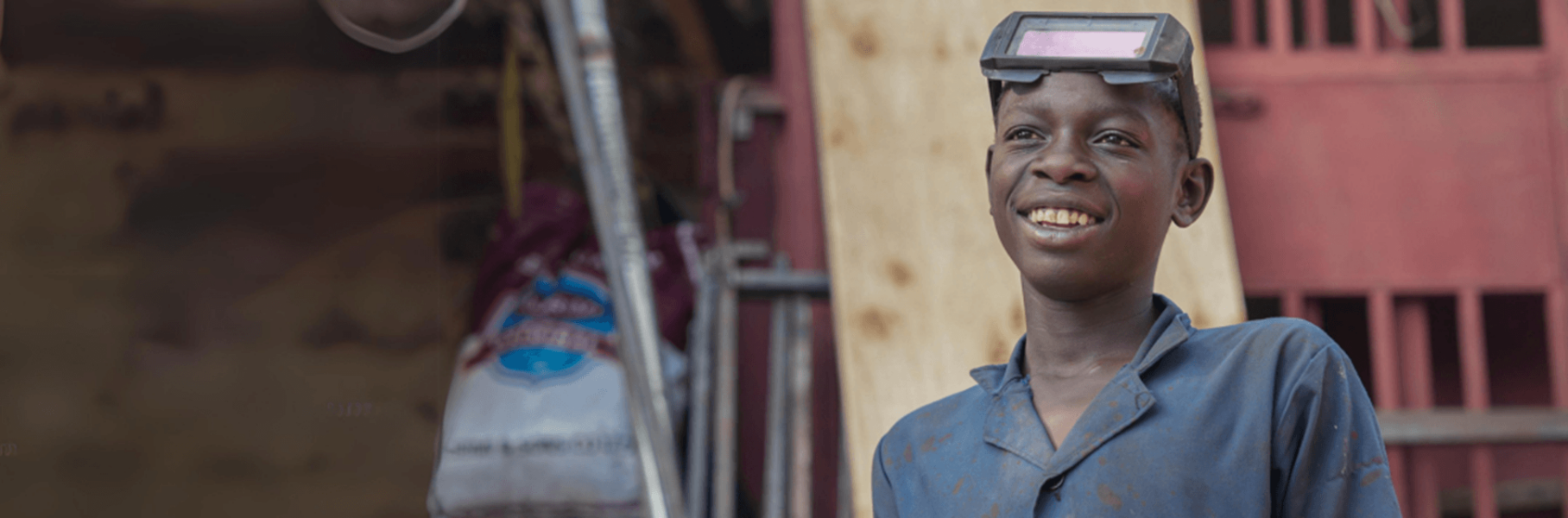 An older teenage male training to be a mechanic with Railway Children's Youth Associations in Tanzania